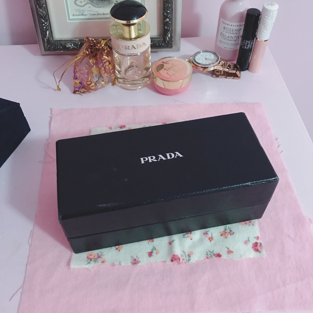 Pink see through frame Prada sunglasses